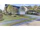 Charming two-story home featuring a well-manicured lawn, landscaping, and a two-car garage at 138 Back Tee Cir, Summerville, SC 29485