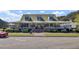 Charming home with wraparound porch, mature landscaping, and a metal roof at 138 Back Tee Cir, Summerville, SC 29485
