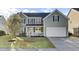 Charming two-story home with a well-maintained front yard and attached two-car garage at 138 Back Tee Cir, Summerville, SC 29485