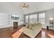 Comfortable living room featuring a fireplace, built-in shelves, and a large window at 138 Back Tee Cir, Summerville, SC 29485