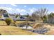 Landscaped backyard featuring a tranquil pond and lush surroundings in a residential neighborhood at 138 Back Tee Cir, Summerville, SC 29485