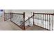 Interior staircase with wood and iron railing and carpeted upstairs hallway at 138 Back Tee Cir, Summerville, SC 29485