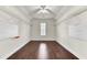 A view of a walk-in closet with hardwood floors, exposed hanging rods, and pegboards at 138 Back Tee Cir, Summerville, SC 29485