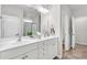 Bright bathroom featuring a double vanity with white cabinetry, and a framed mirror at 139 Ancestry Ln, Moncks Corner, SC 29461