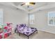 Bright bedroom with neutral walls, plush carpeting, and ample natural light from the shuttered windows at 139 Ancestry Ln, Moncks Corner, SC 29461