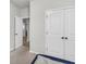 Bedroom featuring carpet flooring and three closets, one of which is open to reveal the room beyond at 139 Ancestry Ln, Moncks Corner, SC 29461