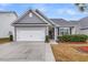 Beautiful home featuring a two-car garage, covered entryway, and professionally landscaped front yard at 139 Ancestry Ln, Moncks Corner, SC 29461