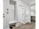 This foyer features a bench with a coat rack and adjacent storage, complemented by modern wood flooring at 139 Ancestry Ln, Moncks Corner, SC 29461