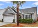 Charming home featuring gray siding, manicured landscaping and a two-car garage at 139 Ancestry Ln, Moncks Corner, SC 29461