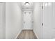 Bright hallway with hardwood floors and white trim, leading to a front door at 139 Ancestry Ln, Moncks Corner, SC 29461