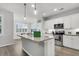 Bright kitchen featuring white cabinets, stainless steel appliances, and a granite island at 139 Ancestry Ln, Moncks Corner, SC 29461