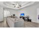 Inviting living room with a large sectional sofa, tray ceilings, and hardwood floors at 139 Ancestry Ln, Moncks Corner, SC 29461