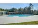 This community pool is surrounded by lush trees and offers a relaxing atmosphere for residents at 139 Ancestry Ln, Moncks Corner, SC 29461