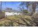 Expansive backyard featuring a wooden deck, mature trees, and plenty of space for outdoor activities at 1605 Evergreen St, Charleston, SC 29407