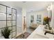 Bright bathroom featuring a glass shower, bench seating, and large vanity with dual sinks at 1605 Evergreen St, Charleston, SC 29407