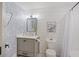 Stylish bathroom features a modern vanity, playful wallpaper, and shiplap walls at 1605 Evergreen St, Charleston, SC 29407