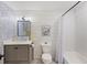 Charming bathroom featuring a vanity, mirror, toilet, and shower-tub combination at 1605 Evergreen St, Charleston, SC 29407