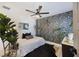 Stylish bedroom featuring bold wallpaper, a ceiling fan, and ample natural light at 1605 Evergreen St, Charleston, SC 29407
