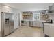 Modern kitchen featuring stainless steel appliances, grey backsplash, and floating shelves; perfect for cooking at 1605 Evergreen St, Charleston, SC 29407