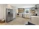 Spacious kitchen with stainless steel appliances, herringbone backsplash, and hardwood flooring at 1605 Evergreen St, Charleston, SC 29407