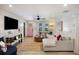Stylish living room with white shiplap walls, hardwood floors, and a cozy sectional sofa at 1605 Evergreen St, Charleston, SC 29407