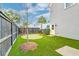 Private backyard featuring well-maintained artificial turf, landscaping, and a fenced perimeter at 1625 Oak Leaf St, Daniel Island, SC 29492