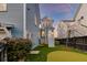 Backyard of home with grass and a putting green in the yard at 1625 Oak Leaf St, Daniel Island, SC 29492