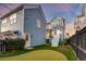 Landscaped backyard featuring a putting green and a view of the rear of the home at 1625 Oak Leaf St, Daniel Island, SC 29492