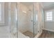 A beautifully tiled glass enclosed shower with two shower heads at 1625 Oak Leaf St, Daniel Island, SC 29492