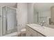 Bright bathroom featuring a glass enclosed shower and a vanity with white stone countertop and modern fixtures at 1625 Oak Leaf St, Daniel Island, SC 29492