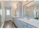 A large bathroom featuring dual sinks and a glass shower stall at 1625 Oak Leaf St, Daniel Island, SC 29492