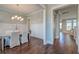 Elegant dining room with hardwood floors and a chandelier, perfect for hosting dinner parties at 1625 Oak Leaf St, Daniel Island, SC 29492