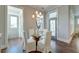 Charming dining area with hardwood floors, a modern light fixture, and access to the outdoors at 1625 Oak Leaf St, Daniel Island, SC 29492