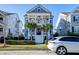 Charming two-story home with a welcoming front porch, columns, and well-manicured landscaping at 1625 Oak Leaf St, Daniel Island, SC 29492