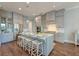 Spacious kitchen with custom cabinets, a large center island, stainless steel appliances, and bar stool seating at 1625 Oak Leaf St, Daniel Island, SC 29492