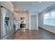Modern kitchen with stainless steel appliances and light gray cabinets and dark wood floors at 1625 Oak Leaf St, Daniel Island, SC 29492