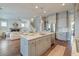 Gourmet kitchen with marble island, stainless steel appliances, and a view of the inviting living room at 1625 Oak Leaf St, Daniel Island, SC 29492