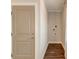 Hallway view of laundry room with hookups, and stylish dark wood floors at 1625 Oak Leaf St, Daniel Island, SC 29492
