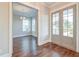 View of a light-filled living room, with an entrance to an adjacent room at 1625 Oak Leaf St, Daniel Island, SC 29492