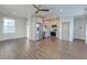 Open-concept living space with hardwood floors, kitchen with stainless steel appliances, and recessed lighting at 1625 Oak Leaf St, Daniel Island, SC 29492