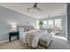 Spacious bedroom with a plush bed, sitting area, and large windows for natural light at 1625 Oak Leaf St, Daniel Island, SC 29492