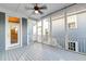 Relaxing screened porch with a ceiling fan, white railings, and ample space for outdoor seating at 1625 Oak Leaf St, Daniel Island, SC 29492