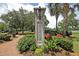 Smythe Park entrance with flowers, a landscaped pathway, and mature trees at 1625 Oak Leaf St, Daniel Island, SC 29492