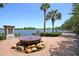Attractive lake view with a custom water feature, palm trees, and a paved pathway at 1625 Oak Leaf St, Daniel Island, SC 29492