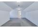 Spacious finished attic area with neutral carpet, and natural light at 1677 French Santee Rd, Jamestown, SC 29453