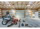 Interior view of barn with mower and tools at 1677 French Santee Rd, Jamestown, SC 29453
