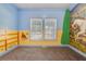 Bright bedroom with an animal-themed mural, adding a playful touch at 1677 French Santee Rd, Jamestown, SC 29453