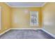Spacious room with a neutral carpet and large window offering ample natural light at 1677 French Santee Rd, Jamestown, SC 29453