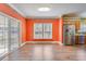 Bright dining room features hardwood floors, sliding glass doors, and stainless steel refrigerator at 1677 French Santee Rd, Jamestown, SC 29453