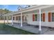 Covered front porch with stone columns, creating a welcoming entrance to the home at 1677 French Santee Rd, Jamestown, SC 29453